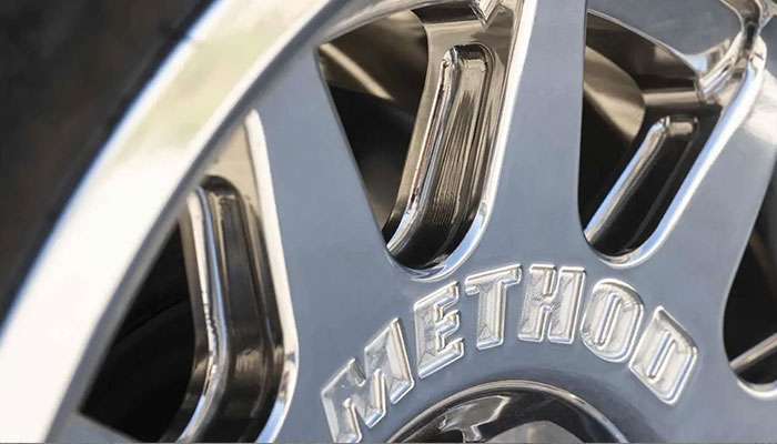 Foose custom five-spoke wheel on classic car